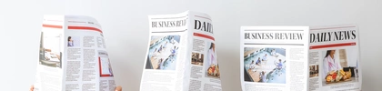 Bild von 3 aufgeschlagenen Zeitungen